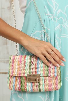 Elevate your style with the TRAVELING GYPSY- Bohemian Woven Gold Chain Shoulder Bag. The intricately woven design adds a touch of bohemian flair, while the shimmering gold chain strap makes a statement. The stylish flap closure keeps your essentials secure, making this bag the perfect blend of bohemian and elegance. Material: 100%Straw Multicolor Spring Pouch Shoulder Bag, Spring Multicolor Pouch Shoulder Bag, Trendy Multicolor Shoulder Bag With Braided Handles, Casual Multicolor Square Straw Bag, Trendy Multicolor Straw Bag With Adjustable Strap, Spring Multicolor Woven Bags, Chic Multicolor Woven Bag, Spring Multicolor Woven Shoulder Bag, Chic Multicolor Rectangular Straw Bag