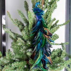 PRICES MAY VARY. Quality Material: Our artificial peacock decoration is made of natural feathers and foam, bright in color and soft to the touch, very like a real peacock. Size: This simulated peacock ornament is 45x7x7cm/17.7x2.8x2.8 inches. There is a metal clip under each artificial peacock bird, which is firmly attached and can be clipped anywhere at will. Realistic Design: This blue peacock decor with long artificial feathers, smart eyes and shiny body. The shape is cute and realistic, very Peacock Christmas Decorations, Christmas Peacock, Peacock Christmas Tree, Feather Peacock, Wedding Tree Decorations, Peacock Ornaments, Peacock Christmas, Peacock Decor, Feather Decor