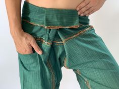 "Unisex Thai fisherman pants. One size fits all. You can wear in many occasions, casual wear, yoga wear, maternity wear, relax at home, travel etc. If you are looking for some pants that you can wear everywhere, comfortable, relax and Easy to wear. Thai fisherman pants is Answer!! Nice gift for yourself or your lover One pocket on the side for storing your items such as wallets, mobile phones, etc Approx. Measurements: One size can fits most and 1 Pockets Measurement Waist 27\" (69 cms) Length 4 Long Yoga Pants With Hip Pockets, Yoga Pants With Hip Pockets For Yoga, Long Yoga Pants With Hip Pockets For Yoga, Green Relaxed Fit Pants For Festival, Yoga Pants With Hip Pockets, Traditional Cotton Stretch Bottoms, Traditional Stretch Cotton Bottoms, Stretch Cotton Meditation Pants, Green Stretch Harem Bottoms