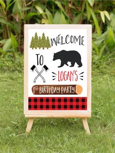 a welcome sign in the grass for a birthday party