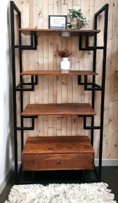 a shelf with some shelves on it and a rug in front of the bookshelf