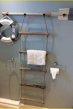 a bathroom with a ladder and towel rack