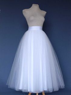 White Tulle Skirt . Wedding tulle skirt .Tea length tulle skirt. Tutu skirt woman. Bridal tutu skirt Elegant Voluminous Tulle Petticoat, Elegant White Skirt For Debutante Ball, Elegant Tulle Tiered Skirt Petticoat, Wedding Tea Length Dress With Tulle Skirt, Elegant Tiered Tulle Petticoat, White Long Tulle Dress, Elegant White Tulle Skirt, White Long Tulle Skirt Dress, White Tulle Long Skirt Dress