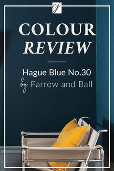 a chair with yellow pillows on it in front of a blue wall that says,'haggue blue no 30 by farrow and ball '