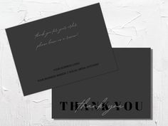 two black and white business cards with the words thank you written on them, one in silver ink