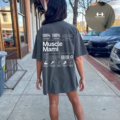 Introducing the Muscle Mami T-Shirt, the ultimate statement piece for all the gym baddies out there! Designed with powerlifting and weightlifting in mind, this gym tee is perfect for those who want to express their strength and confidence. .: The Comfort Colors 1717 tee is made with medium fabric (6.1 oz/yd² (206.8 g/m consisting of high quality, 100% ring-spun US cotton for long-lasting comfort. .: The relaxed fit keeps the wearer comfy in both casual and semi-formal settings while the crew neckline delivers that classic, neat style which makes it perfect for accessorizing.  .: The pre-shrunk fabric ensures a consistently great fit. Check all available sizes in our Comfort Colors 1717 size chart.  .: All Comfort Colors 1717 shirts feature pre-shrunk cotton for size retention and a signatu Short Sleeve Activewear With Logo For Gym, Slogan T-shirt For Workout Athleisure, Athleisure Slogan Workout T-shirt, Athleisure Muscle Tee With Graphic Print Crew Neck, Athleisure Crew Neck Graphic Print Muscle Tee, Sporty Short Sleeve Muscle Tee With Letter Print, Sporty Slogan T-shirt For Gym, Graphic Tee Activewear With Logo For Workout, Sporty Graphic Print Muscle Tee For Workout