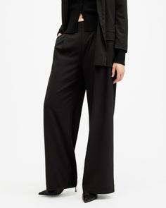 AllSaints tailoring. The Aleida Pants are crafted from a fluid fabric that's super easy to wear. Sitting mid-rise on the waist with flowing wide leg shaping. They've got an easy fit that can easily be taken from day-to-night.   These pants are designed to a regular fit Mid-rise Two side pockets Two back pockets Elasticated waist band Wide leg shape Elegant High-waisted Viscose Pants, Elegant Wide Leg Viscose Bottoms, Full-length Viscose Pants For Workwear, Full-length Viscose Workwear Pants, Viscose Full-length Workwear Pants, Viscose Wide-leg Pants With Elastic Waistband, Elegant Full-length Viscose Bottoms, Elegant Full Length Viscose Bottoms, Tailored Ankle-length Wide Leg Pants