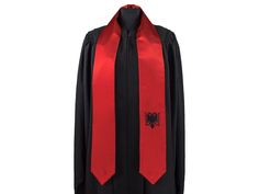 Celebrate your graduation with our quality 72″ Albania flag sash. - Ideal for International or Study Abroad Student - Rounded, not V neck in back, made from dancelight satin, and fully lined to hang nicely in front - Conceptual flag incorporated into the design - Perfect way to show heritage or accomplishments - Keepsake Memorabilia Do you want two flags on your sash, try this option. https://www.etsy.com/listing/968056475/graduation-sash-with-two-flags?ref=listings_manager_grid Graduation Scarf Design, Cheap Multicolor Graduation Stole, Satin Graduation Stole With Sashes, Multicolor Embroidered Graduation Stole, Ordination Stoles Red, Traditional Embroidered Graduation Stole, Albania Flag, Graduation Sash, Albania