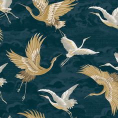 a group of birds flying in the sky with gold and white feathers on a blue background