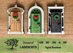 three doors with wreaths hanging from them on a wooden wall next to a tree