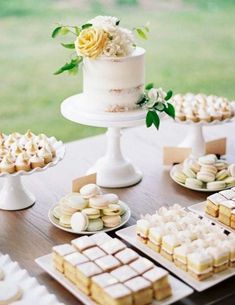 a table topped with lots of desserts and cakes