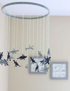 a baby crib with toy animals hanging from it