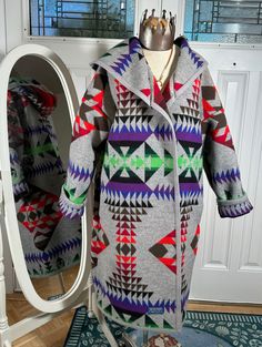 Yes, this is a Pendleton blanket that I upcycled into this gorgeous coat.  Unfortunately I cannot use the Pendleton name in the title. Warm and comfy, Pendleton does not make a long coat with a hood, but I do  I have designed a cut for Pendleton blankets that incorporates the binding all along the edges of my coat.  Bottom hem, up both front panels and all around the hood.  I've gotten really good at utilizing that gorgeous Pendleton pattern and matching it at the seams do make sure to zoom in. Pendleton Pattern, Pendleton Blankets, Wool Blanket Coat, Pendleton Blanket, Blanket Coat, Wool Blanket, Long Coat, Wool Coat, Fashion Fashion