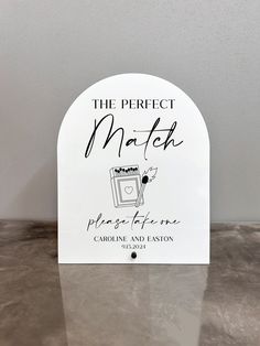 the perfect match sign is shown on a table