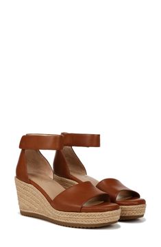 Experience ultimate style and arch support with every step you take in this comfortable espadrille wedge sandal complete with a dainty ankle strap. 2 3/4" heel; 1" platform
 Adjustable ankle strap with hook-and-loop closure Cushioned insole PU upper/synthetic lining and sole Imported Leather Wedge Sandals With 4-inch Heel And Ankle Strap, Beige Espadrille Slip-on Wedge Sandals, Beach Slip-on Wedge Sandals With Woven Sole, Adjustable Closed-toe Espadrille Wedge Sandals, Beige Synthetic Wedge Sandals With 4-inch Heel, Every Step You Take, Espadrille Wedge, Wedge Sandal, Sandal Women