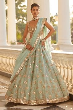 Powder blue attached cancan lehenga with all over mirror butti embroidery and sequin embellishments. Paired with a padded blouse with mirror work and dupatta with mirror work border. - Aza Fashions Lehenga For Wedding Guest, Lengha Modern, Blue Indian Outfit, Modern Lehenga Designs, Blue Organza Lehenga, Modern Lehenga, Mirror Blouse, Culture Outfits, Intricate Mirror