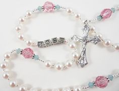 Swarovski Rosary in Pink and Green by RosaryGardenCathy on Etsy Pretty Rosaries, Handmade Pink Jewelry For Baptism, Handmade Pink Rosary For First Communion, Personalized Rosary With Round Beads For Baptism, Handmade Pink Rosary For Baptism, Pink Rosary With 8mm Beads For Gift, Pink Beaded Spiritual Rosary, Handmade Pink Spiritual Rosary, Catholic Baptism