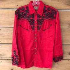 New With Tags 65% Polyester, 35% Rayon Imported Button Closure Machine Wash 65% Polyester / 35% Rayon Long Sleeve Floral Tooled Embroidery (Front/Back) And Cuff. Fitted Embroidered Red Shirt, Fitted Red Embroidered Shirt, Red Embroidered Long Sleeve Shirt, Western Style Long Sleeve Embroidered Shirt, Western Long Sleeve Embroidered Shirt, Western Dress Shirts, Western Style Button-up Shirt For Ranch, Western-themed Cotton Shirt With Button Closure, Mens Western Shirts Long Sleeve