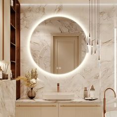 a bathroom with marble walls and flooring has a round mirror on the wall above the sink