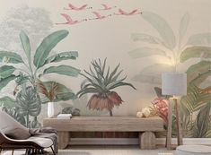 a living room scene with a couch, table and plant wallpaper on the walls