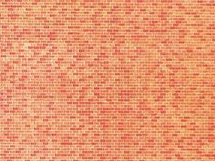 an orange brick wall that has been made out of red bricks and is being used as a background