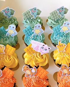 cupcakes decorated with different designs and colors