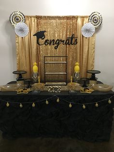 a black and gold graduation party with decorations