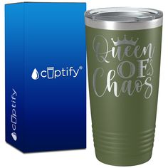 a green tumbler with the words queen off chaos on it next to a blue box