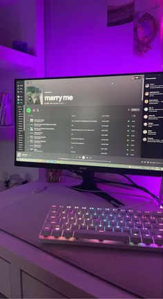 a computer monitor sitting on top of a desk with a keyboard and mouse in front of it