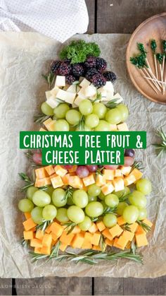 a christmas tree made out of cheese and grapes