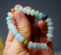 Certified 100% Natural  A Graded  Icy Jadeite Jade Carved Multi-Colored Drum Beads Beaded Bracelet 6.35 inches Gemstones  天然起冰起光多宝翡翠鼓珠手串 2337 🌷Material :Untreated Natural Jadeite/ Grade A Jade Fei cui (翡翠) 🌻Certified : yes.   🌻 100% handmade carving 🌷 Size : Dimensions :9 x 5.2 mm/each bead .weight :24.9 grams .Resizeable size . 🌻 Color : Multi-Colored color .look at the pictures 🌷Tpye :icy type.冰种 🌻 condition : As it's natural Type-A jadeite and handmade, every bead may not have exact diameter plus some natural stone lines and imperfections are expected too. Kindly check the photos carefully to ensure you have accepted those natural imperfections prior to buying. As pictures .The material object is nicer than those pictures .As pictures .The material object is nicer than those pict Multi Colored Jade Bracelet, Salary Increase, Bean Pods, Life Gets Better, Chinese Mythology, Good Luck To You, Gourds, Botany, Beaded Bracelet