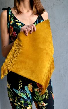 "Medusa Clutch in mustard gold. An adorable leather clutch with fringes for beautiful fashion looks. This envelope clutch is ideal to carry anything you might need! A handmade clutch from Italian genuine suede leather in mustard colour and silk fringes. The interior is fully lined with beige leatherette. It closes with one metal rivet stud in silver or gold. The pictures show the clutch with gold stud. Dimensions: Height 23 cm (9,06\"), Length 32 cm (12,6\") Do you want to use your clutch as a s Gold Rectangular Bag With Fringe, Gold Fringe Rectangular Bag, Chic Rectangular Clutch With Fringe, Gold Clutch Bag With Tassels, Chic Rectangular Fringe Clutch, Envelope Clutch Purse, Leather Envelope Clutch, Leather Fringe Bag, Leather Laptop Case