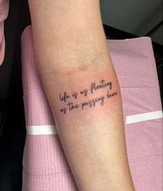 a person with a tattoo on their arm that says, life is so pleasing as the messy hour