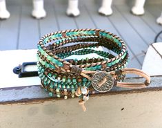 Macrame 5x wrap bracelet with 4 different patterns. The perfect seafoam, tan, brown, boho leather wrap bracelet. Dress up or wear with jeans, this bracelet is sparkly and perfect for any occasion. *genuine 1.5mm Leather cording *Japanese glass seed beads *4 distinct patterns Brown Hand Wrapped Wrap Bracelet For Beach, Green Bohemian Wrap Bracelet For Festival, Artisan Turquoise Wrap Bracelet For Festivals, Handmade Bohemian Turquoise Leather Bracelet, Handmade Turquoise Leather Bracelet, Bohemian Style, Handmade Turquoise Leather Bracelet In Bohemian Style, Bohemian Turquoise Leather Bracelet As Gift, Boho Leather, Gift For Her Birthday