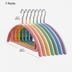 the multicolored coat rack has seven hooks on it