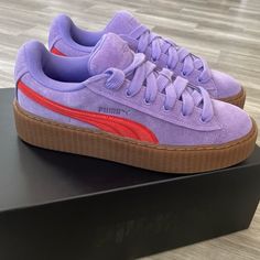 Never Worn New In Box Extra Lances Elevate Your Sneaker Game With These Puma Creeper X Fenty Boxing Shoes. With A Stylish Lavender And Burnt Red Colorway, These Sneakers Are Perfect For Any Fashion-Forward Woman. The Suede Upper Material And Athletic Design Make Them Suitable For Both Casual Wear And Sports Activities. Featuring A Size 8.5 Us Shoe Size And The Iconic Puma Style Code 399332-03, These Sneakers Are A Must-Have For Any Sneakerhead. The Boxing Performance Activity Adds An Extra Layer Casual Purple Sneakers With Puma Logo, Purple Platform Lace-up Sneakers, Casual Purple Puma Sneakers, Purple Puma Sneakers With Round Toe, Purple Low-top Sneakers With Puma Logo, Fenty Puma Shoes, Purple Low-top Puma Sneakers, Puma Rihanna Fenty, Purple Fade-resistant Synthetic Sneakers