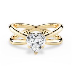 a gold ring with a heart shaped diamond in the center and two bands around it