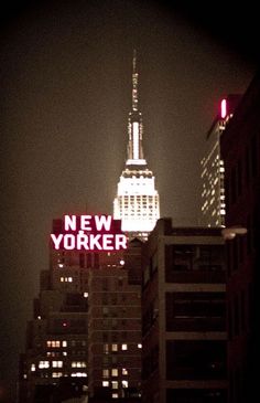 the empire building is lit up at night