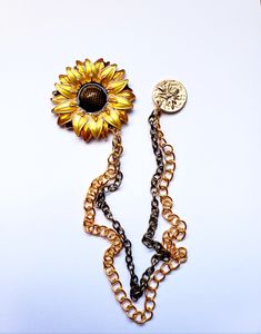 Looking for a distinctive and long-lasting accessory that effortlessly elevates your style? It's time to discover our Sunflower Lapel Chain Pin! It is a meticulously handcrafted masterpiece made from high-quality alloy and steel. This versatile accessory is designed to complement any outfit, whether it's adorning your lapel or adding a touch of charm to your shirt. Whether it's embellishing your lapel or bringing some flair to your shirt, this adaptable item is made to match any ensemble. It is more than just an accessory; it's a symbol of elegance and sophistication. Perfect as a gift for friends, family, and loved ones, this Sunflower Lapel Chain Pin is ideal for daily wear, weddings, and various occasions. Its timeless design allows you to express your style and make a statement. Enhanc Lapel Chain, Kids Ties, Collar Chain, Collar Pins, Tie Pin, Sunflower Design, Watch Chain, Tie Bar, Pin It