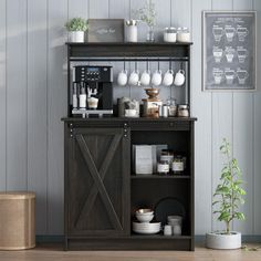 a coffee bar with lots of cups on top of it and shelves above the counter