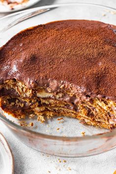 a chocolate cake is cut in half on a plate