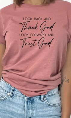 Look back and Thank God look forward and Trust God Inspirational Graphic Tee. Most t-shirt colors are 52/48 cotton/polyester blend. Athletic Heather is 90/10 cotton/polyester. White, cream and canvas red are 100% cotton. Ash is 99/1 cotton/polyester. Basic Pink T-shirt For Fall, Inspirational Pink Cotton T-shirt, Pink Soft-washed T-shirt For Fall, Inspirational Cotton Summer Tops, Inspirational Cotton Tops For Summer, Pink Cotton Inspirational T-shirt, Inspirational Cotton T-shirt For Fall, Inspirational Graphic Tees, Heather Brown