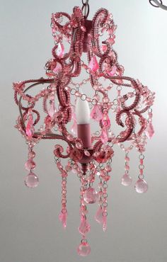 a pink chandelier hanging from the ceiling