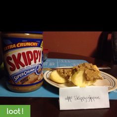 a bowl of soup next to an apple slice and yogurt on a plate