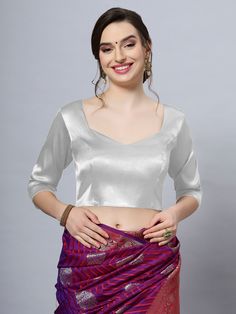 Our Satin Comfort Stretch collection blouses are made to impress and made to be worn all day. Made from the finest satin-cotton blend stretchable fabric, it holds its shape and shine while offering the comfort of stretchable material. Wear it with your favorite saree, as a crop top or lehenga choli! Item Type: Saree blouse / Crop top Product Features: Color: Silver Fabric: Satin Stretch Trim: Back Dori Neck Style: Front- Sweetheart & Back- Pentagon Sleeve Length: Elbow Sleeve Closure: Back Hook Fitted V-neck Padded Blouse Top, Fitted V-neck Padded Blouse, Fitted Padded V-neck Top, Stretch Padded Long Sleeve Blouse, Fitted Solid Satin Shirt, Fitted V-neck Solid Color Blouse, Solid Fitted V-neck Blouse, Fitted Satin Tops In Solid Color, Fitted Solid Satin Tops