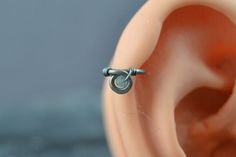 the inside of an ear with two screws on it