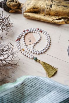 Spiritual jewelry, mala, jewelry, necklaces, 108 beads, mantra mala, chakra healing, tassel necklace, gift for him, calm the mind, hand made mala, yoga mala beads. ----- FREE SHIPPING -------  This listing is for ONE mala necklace. This healing mala necklace features 108 beads (6mm) of Howlite Mookaite + Agate(guru). Whether as a calming meditation guide or a beautiful, neutral, and natural statement piece, this necklace will be a great addition to your spiritual practice. GEMSTONE PROPERTIES: - Bohemian 108 Beads For Meditation, White 8mm Beads For Festival, Spiritual Tassel Necklace With 108 Round Beads, Bohemian Mala With Colorful Beads For Meditation, Bohemian Beaded Necklace With 108 Beads For Rituals, White Natural Stones Beads For Healing, Festival White Gemstone Beads, White Adjustable Mala With Gemstone Beads, Adjustable White Mala With Gemstone Beads