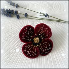 This lovely handmade brooch can be worn for any occasion, adding an instant lift to your wardrobe. Made with deep red crushed velvet and beads. Every petal is individually embroidered with gold metallic thread and beads and supported by wire on the inside, so may be bend in the way you like it. Perfect for brightening up your winter coat, dress or scarf. Size: 7 cm diameter, butterfly clasp. There are two options to choose from: brooch pin or hair clip. Velvet Brooch, Red Flower Brooches For Gift, Red Handmade Flower Brooches, Red Flower-shaped Brooch With Handmade Flowers, Handmade Red Flower Brooches, Handmade Flower-shaped Pins For Gifts, Handmade Elegant Red Brooches, Elegant Handmade Red Brooches, Elegant Red Handmade Brooches