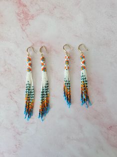 **Handwoven with the  Miyuki Delica beads.** **Earwires are surgical steel.** **Each earring L-11 cm and M-9 cm long and weighs  L-3g, M-2g.** **Please keep your earrings away from water, chemicals, and perfume.** **10% OFF 2 ITEMS FROM THE SHOP.** **Thanks for looking! Be sure to check out my other jewelry: serhatbeads.etsy.com** **If you have any questions, please feel free to contact me.** Jewelry Colorful, Miyuki Delica Beads, Beads Work, Earrings Summer, Seed Bead Patterns, Bead Weaving Patterns, Beads Bracelet Design, Long Fringe, Bead Work Jewelry