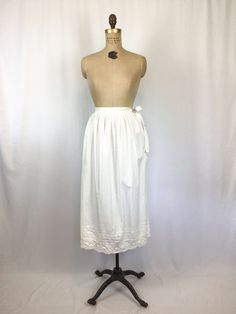 "Vintage Edwardian white cotton lace underskirt Standard waist with ties for closure, shown tied at side and in back. When tied in back there is a seam down the front Pleated at waist band Bottom of skirt is trimmed in three horizontal rows of pintucks and hemmed in a cotton crochet lace This is beautiful and could be worn as a slip or even a skirt MEASUREMENTS: Fits like a Small/Medium Waist: 30\" Hips: upto 54\" Length: 32\" Label/Brand: None Condition: Excellent Stay in touch: Instagram https Petticoat Skirt, Skirt Measurements, Shirtwaist Dress, Half Slip, Lace Shift Dress, Cotton Crochet, Cotton Lace, Dot Dress, Petticoat